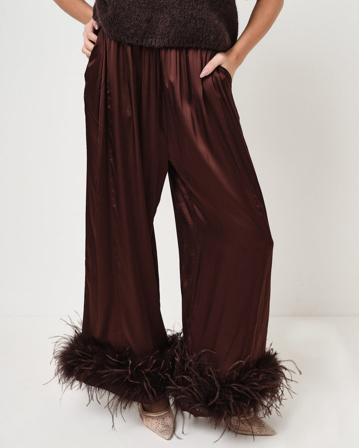 Pantalone in raso con piume