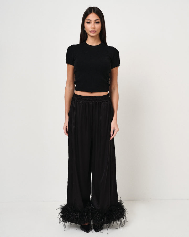 Pantalone in raso con piume