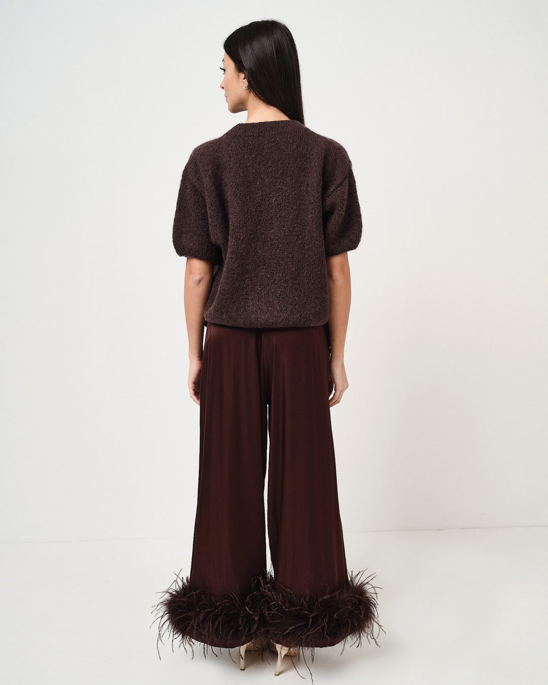 Pantalone in raso con piume